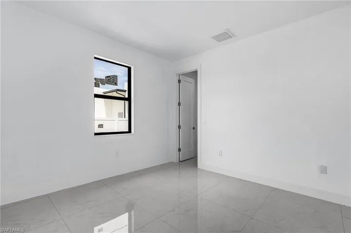 View of tiled spare room