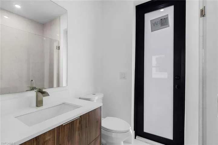 Bathroom featuring vanity and toilet
