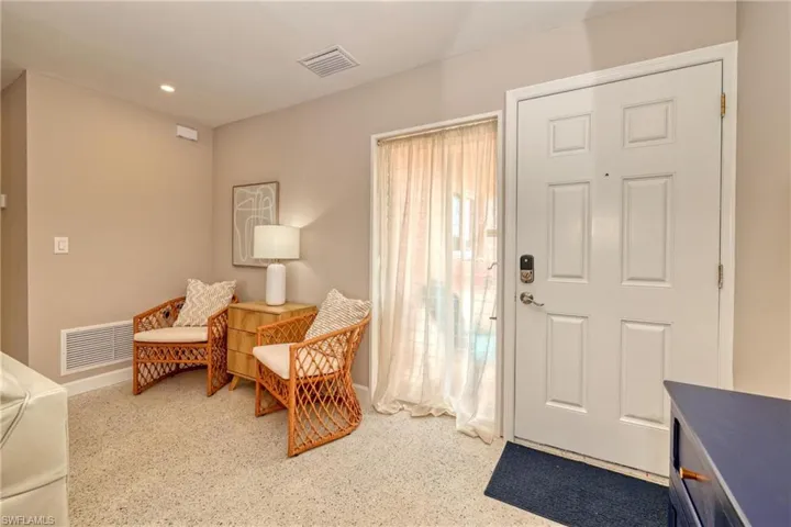 Entryway with baseboards, visible vents, and recessed lighting