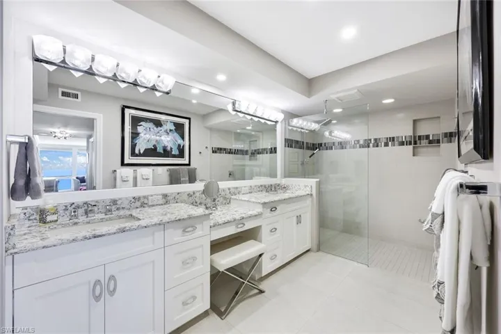 En-suite primary bath with large walk in shower
