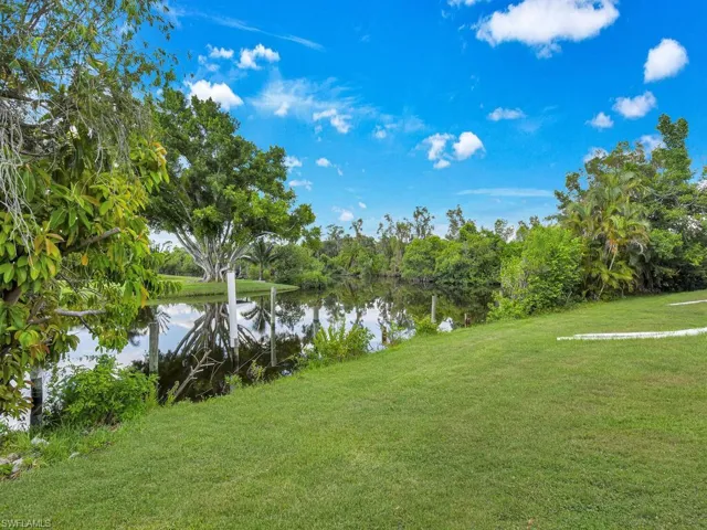 View of yard with a water view