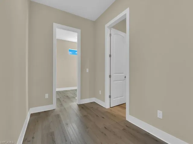 Unfurnished room featuring wood-type flooring