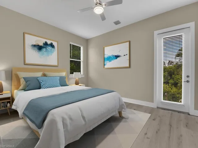 Bedroom featuring ceiling fan and light hardwood / wood-style flooring