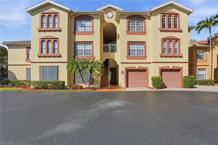 Virtually staged view of front facade featuring stucco siding, driveway, and a garage