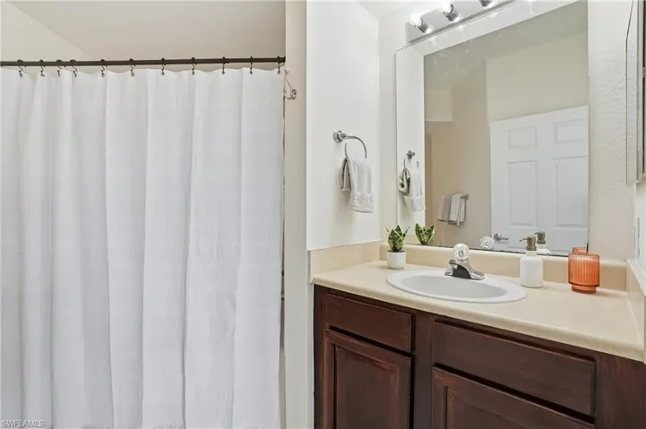 Bathroom featuring vanity and a shower with curtain
