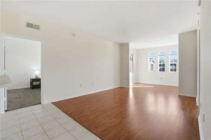 Spare room with light wood finished floors and baseboards