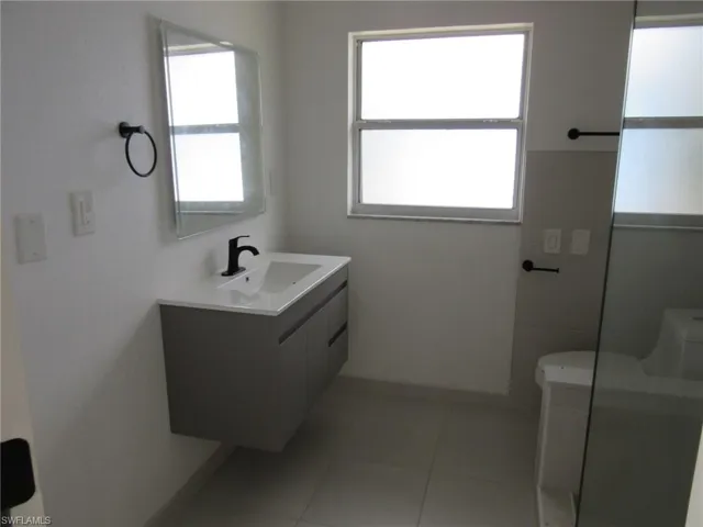 Bathroom featuring vanity and light tile patterned flooring