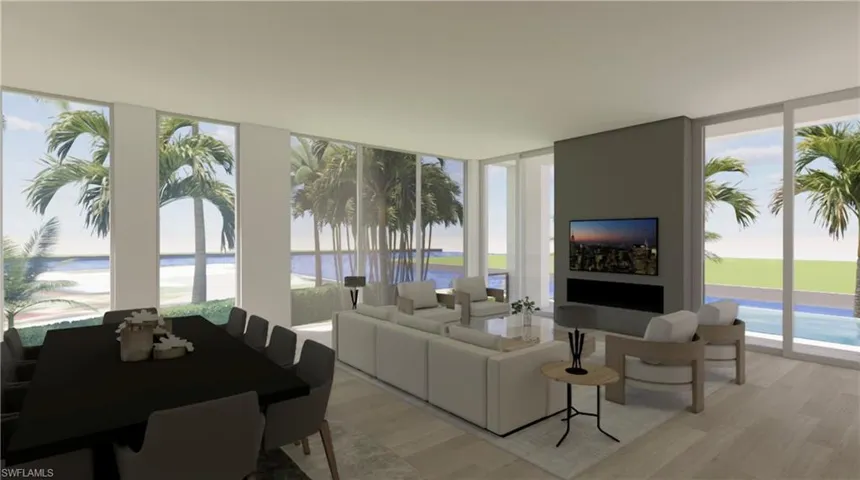 Living room featuring floor to ceiling windows, light wood-style flooring, and plenty of natural light