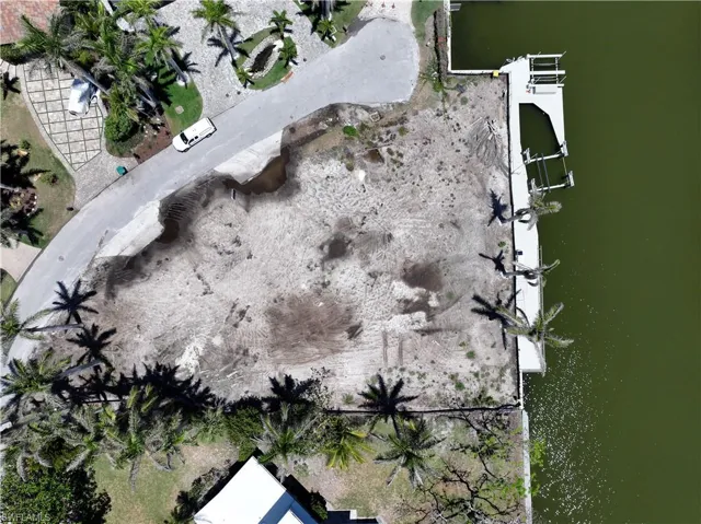 Aerial overview of property's location featuring a large body of water