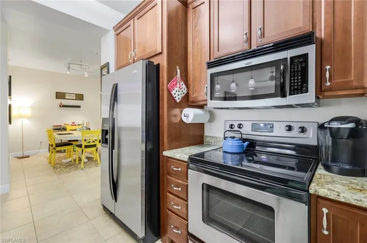 Stainless steel appliances and a fantastic pantry for storage