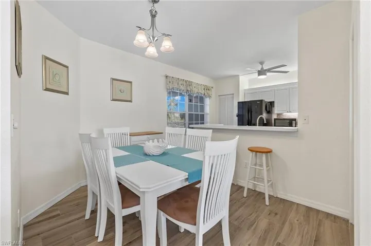 Dining and Kitchen Area - Virtually Enhanced Photo
