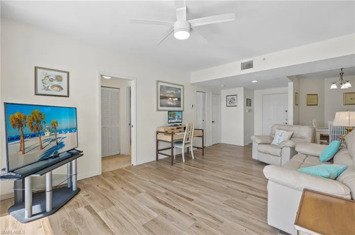 Open Living Area Facing the Front Door - Virtually Enhanced Photo
