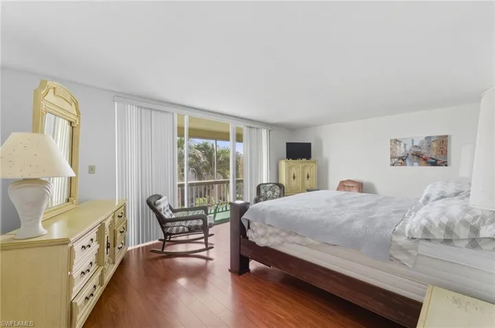 Bedroom featuring dark wood-type flooring