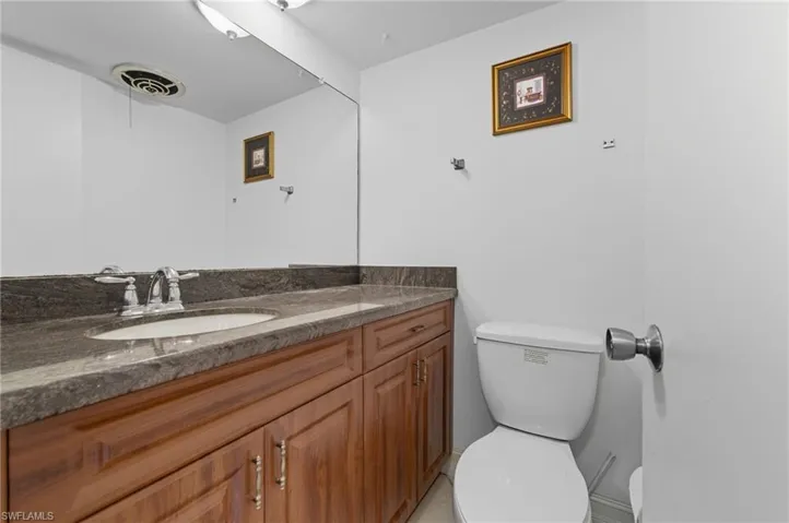 Half bath with vanity and toilet