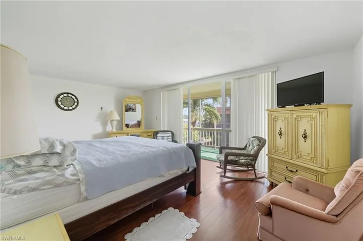 Bedroom with wood finished floors