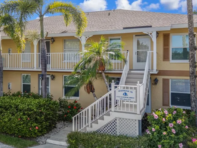 View of property featuring stairway