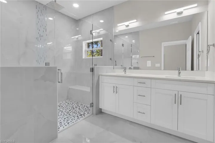 The Huge Master Shower Has A Glass Door, Tile Waterfall, Built-In Bench, And Ceiling Rain Head With A Hand Wand!