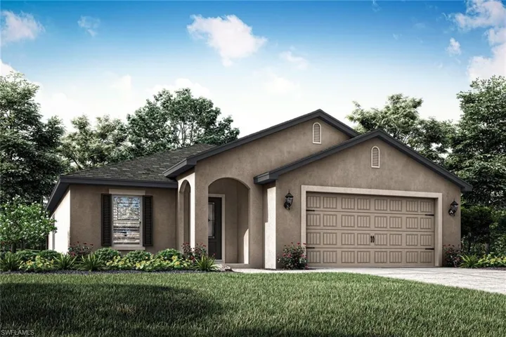 View of front of house with a front yard and a garage