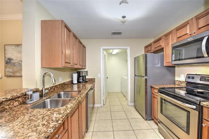 Kitchen with lots of granite, tile and stainless steel appliances!