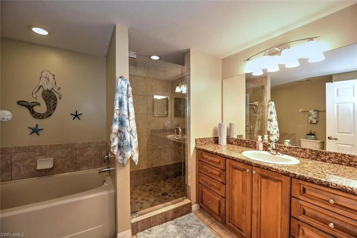 Master bathroom with glass shower & separate soaking tub!