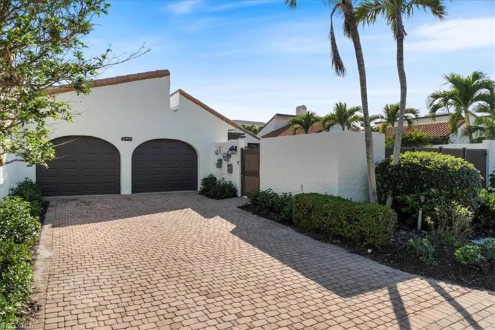 Mediterranean / spanish-style house with a garage