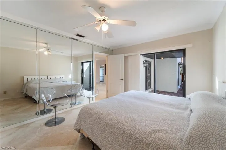 Bedroom with crown molding and ceiling fan