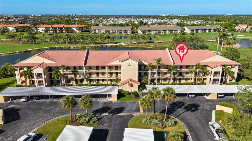 Birds eye view of property with a water view