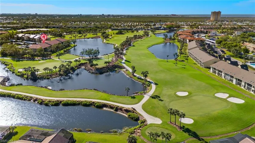 Drone / aerial view featuring a water and golf course view
