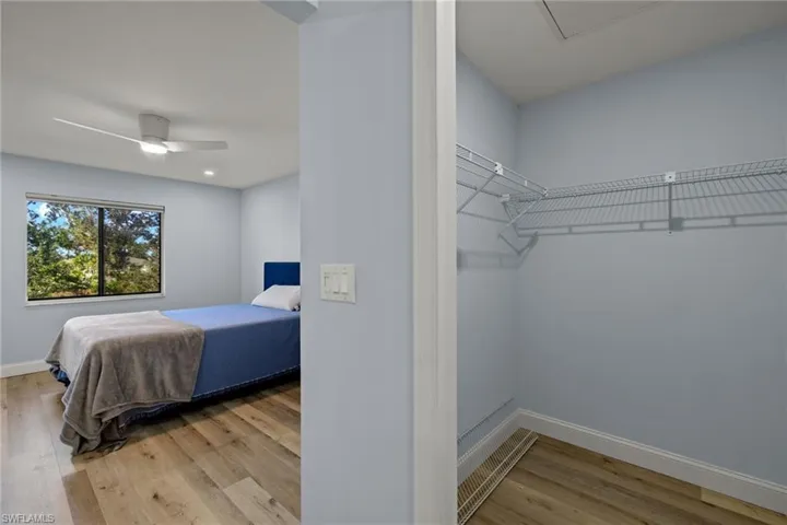 Primary bedroom boasting large walk-in closet