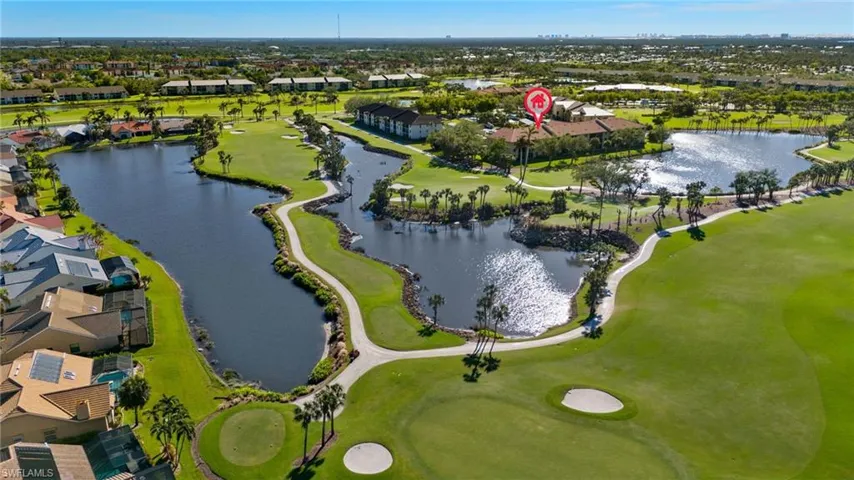 Aerial view with a water and golf course view