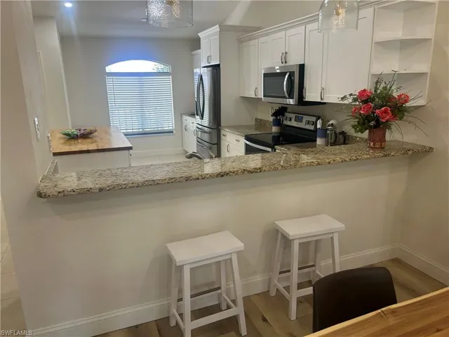 Open concept kitchen with abundant amount of cabinets
