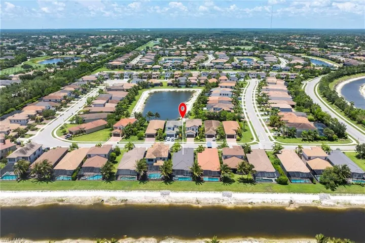 Aerial view of residential area with a large body of water