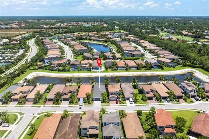 View of property location featuring nearby suburban area and a large body of water