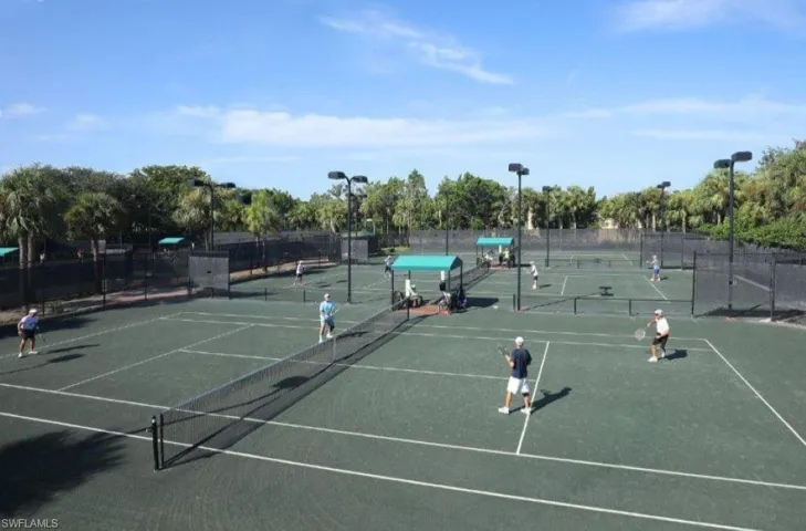 View of tennis court with community basketball court