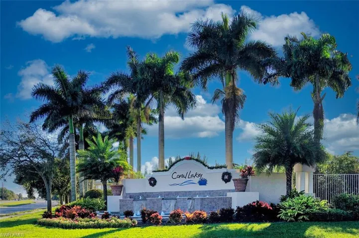 Community sign featuring a lawn