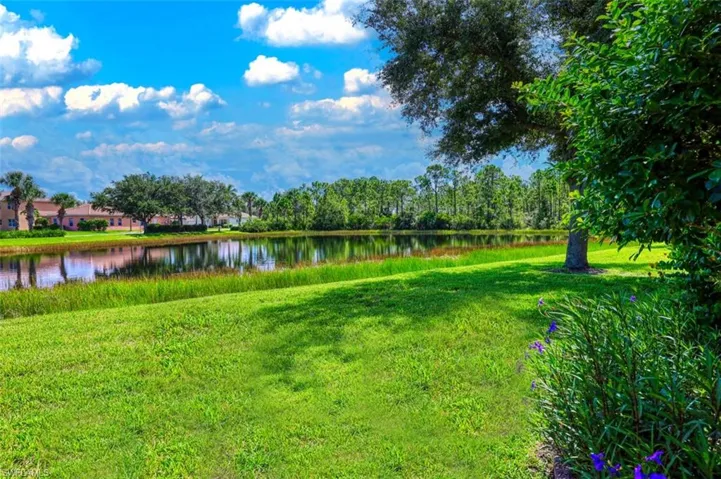 View of green lawn with a water view