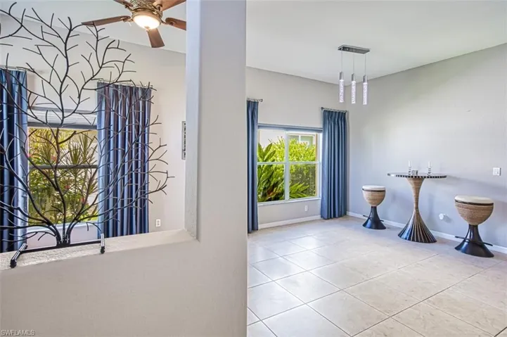 Bathroom featuring tile patterned flooring and ceiling fan