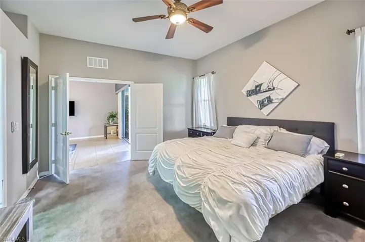 Bedroom with carpet flooring and a ceiling fan