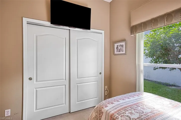 Bedroom with carpet floors and a closet