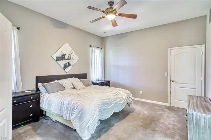 Bedroom with carpet flooring and ceiling fan