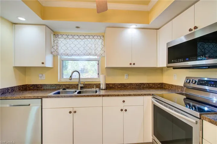 A big double sink and all stainless steel appliances