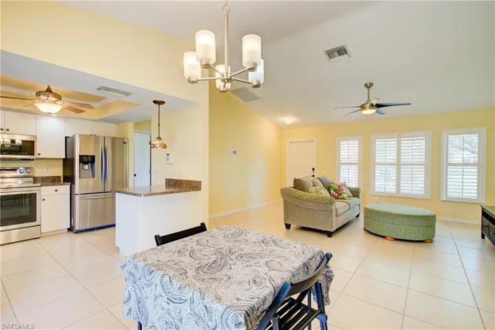 The convenient dining area has a great view of the yard