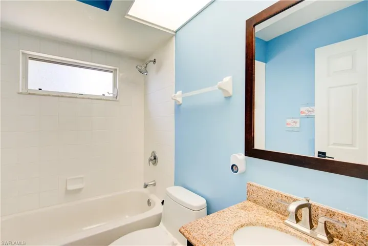The guest bathroom with a tub/shower combo