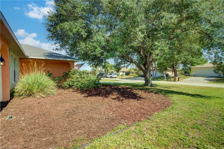 A well kept lawn with a Rainbird automatic sprinkler system