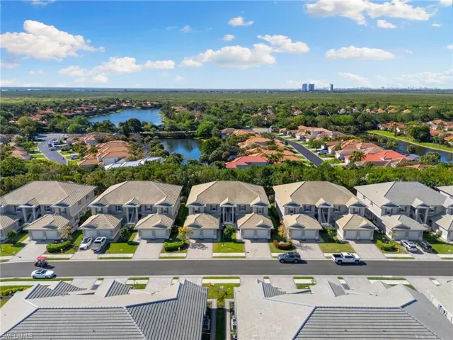 Aerial view featuring a residential view and a water view