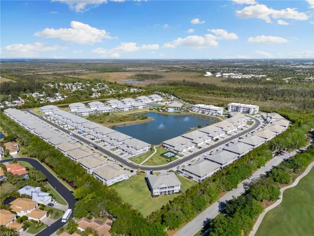 Aerial view featuring a water view and a residential view