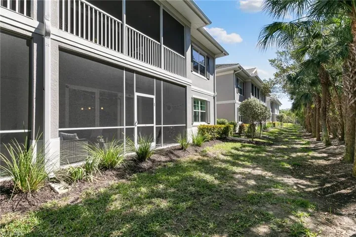 View of yard with a sunroom