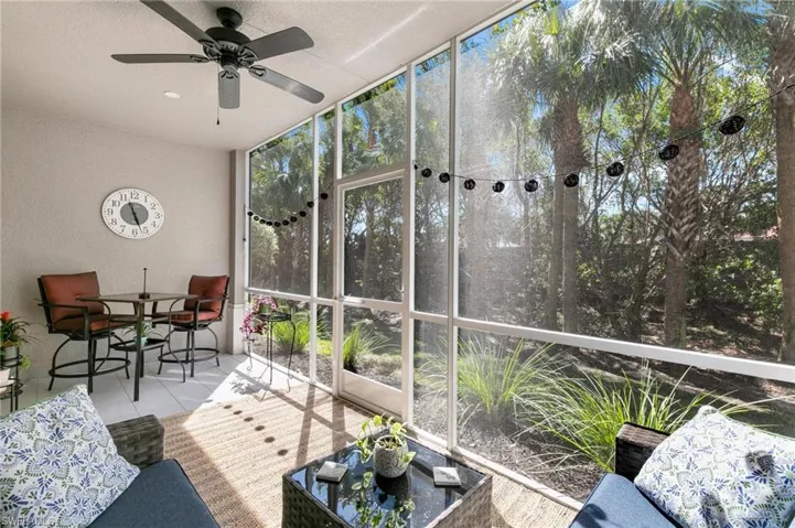 Unfurnished sunroom with a ceiling fan