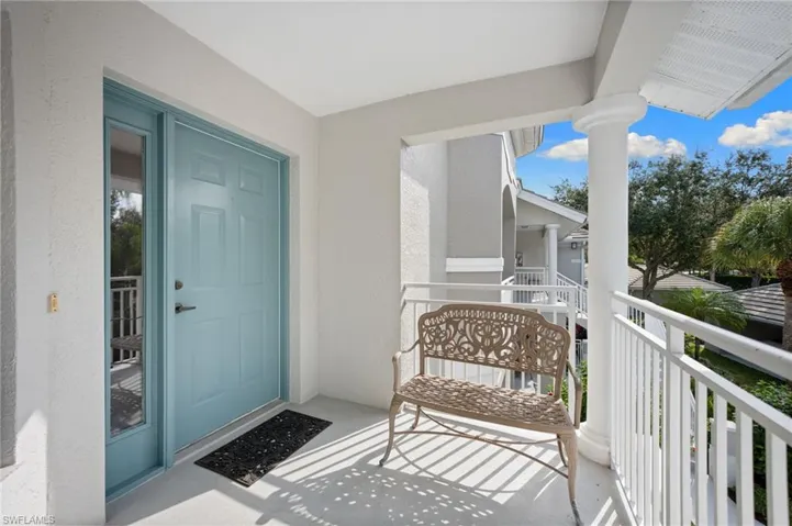 Doorway to property with stucco siding