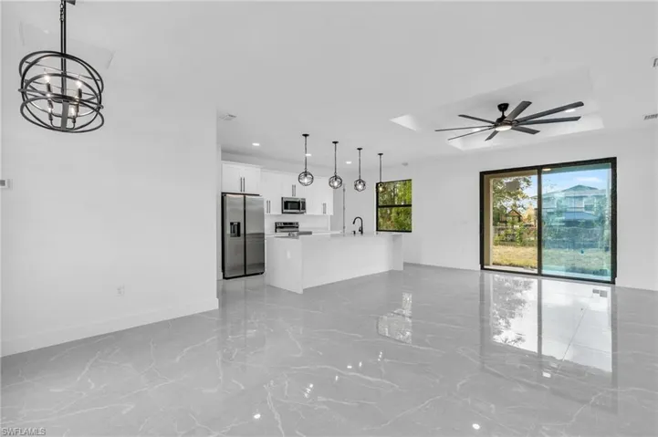 Unfurnished bedroom with ceiling fan and a closet